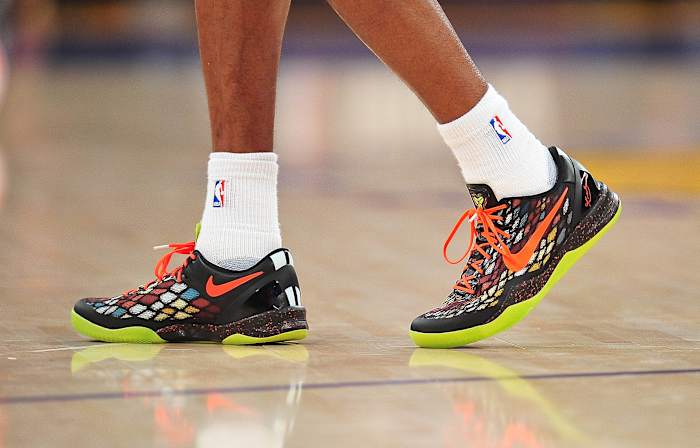 View of black and orange Nike Kobe shoes.